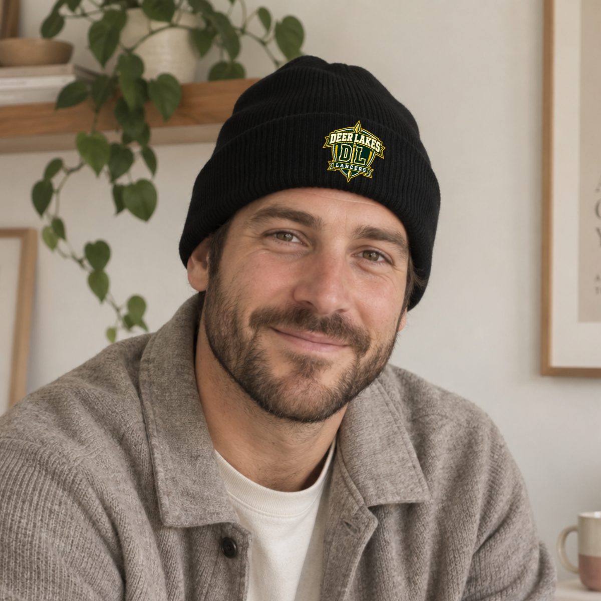 Black Deer Lakes Lancers knit beanie with green and gold DL crest design