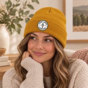 Gold Deer Lakes Lancers knit beanie with green and white circular lance badge